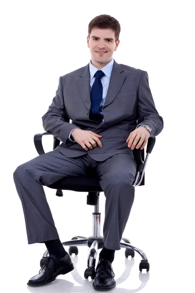Affärsman sittplatser på stol — Stockfoto
