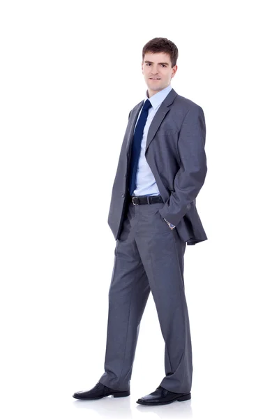 Uomo d'affari in piedi con le mani in tasca — Foto Stock