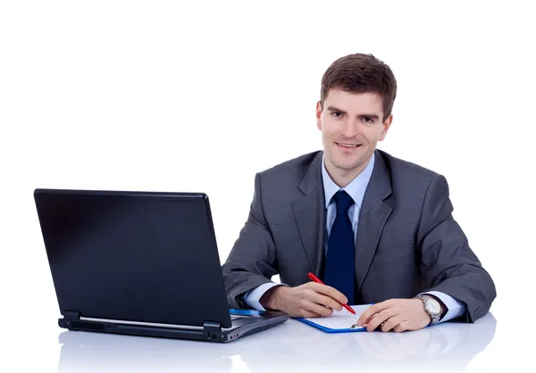 Business man writting at desk — Stock Photo, Image