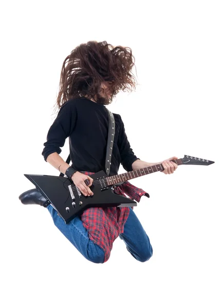 Heavy metal guitarist jumps in the air — Stock Photo, Image
