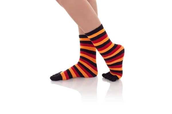 Woman legs in zebrine socks — Stock Photo, Image