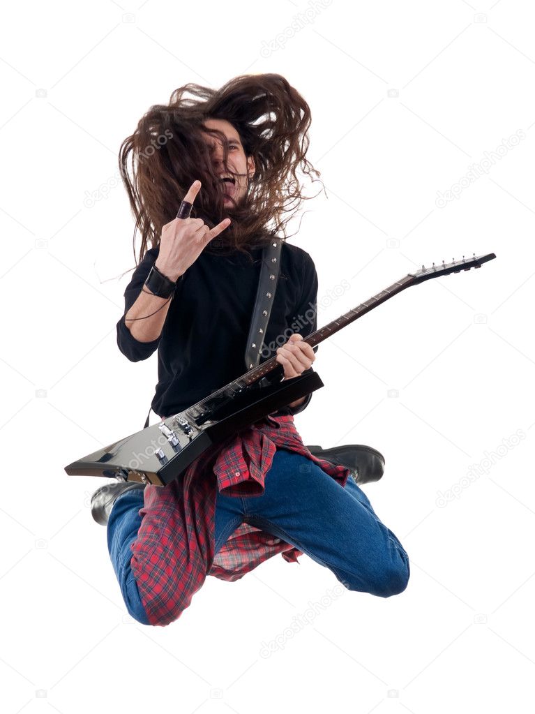 Heavy metal guitarist jumps in the air
