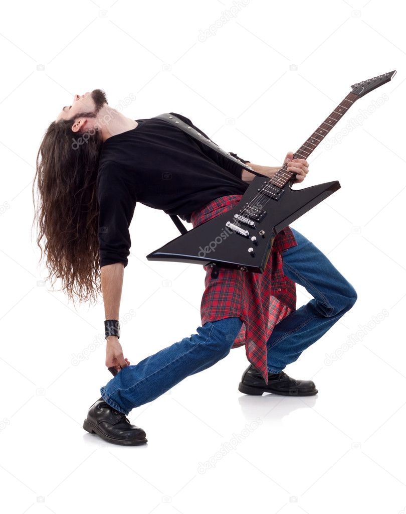 Long haired guitarist is playing a guitar