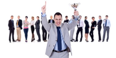 Winning businessteam leader holding trophy clipart