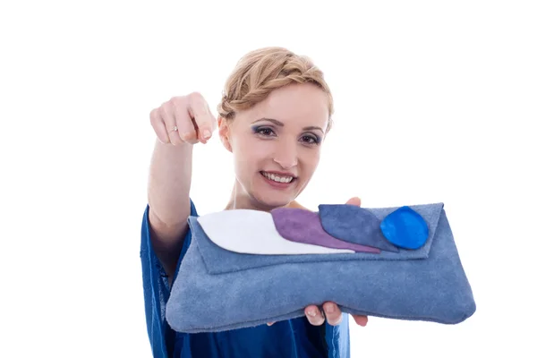 Smiling woman pointing to bag — Stock Photo, Image