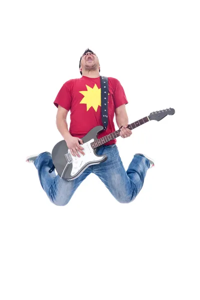 Awesome guitar player jumps — Stock Photo, Image