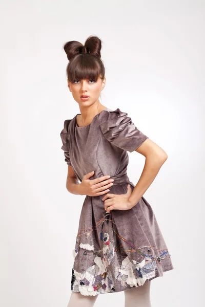 Beautiful brunette wearing elegant dress — Stock Photo, Image