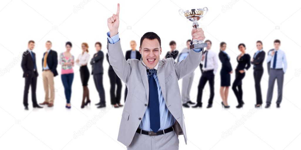 Winning businessteam leader holding trophy