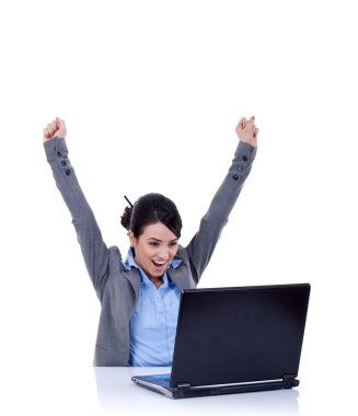 Young woman in office jubilates at desk clipart