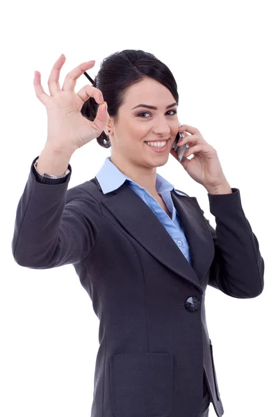 Женщина с телефоном и жестом ОК — стоковое фото