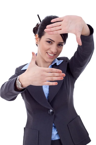 Mulher de negócios olhando através de uma moldura de mão — Fotografia de Stock