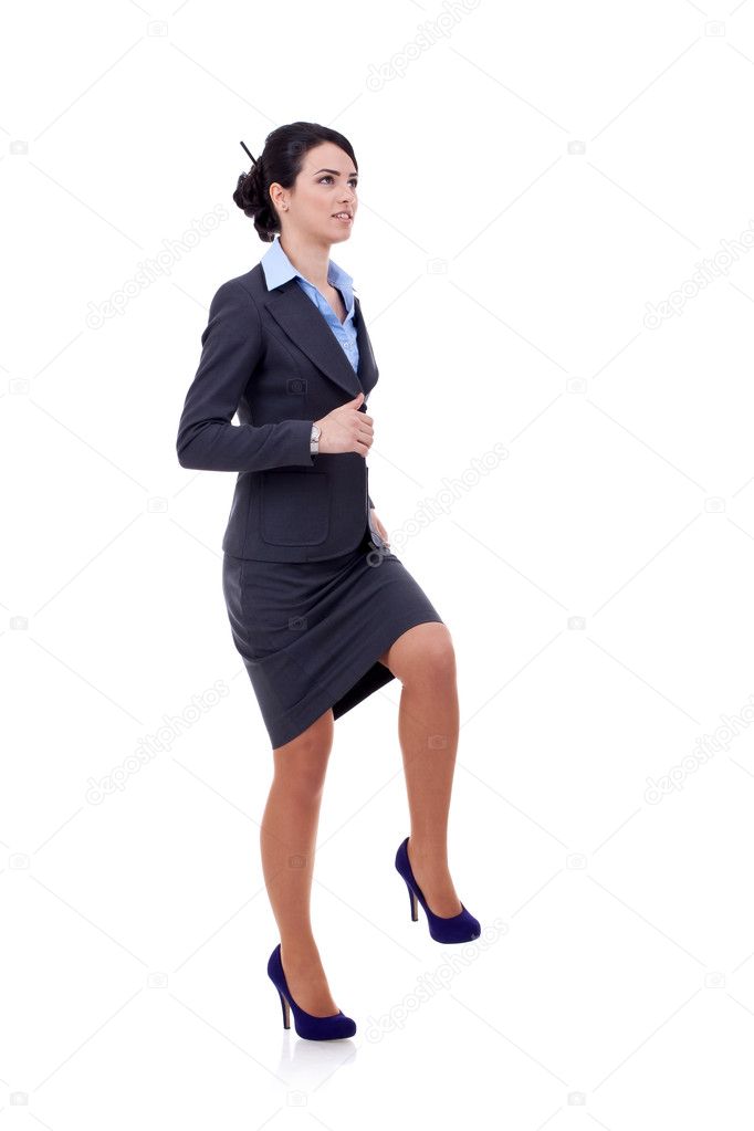 Business woman stepping on imaginary step