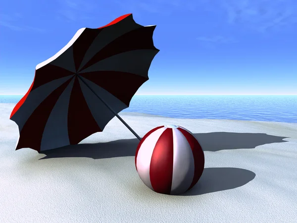 Zon parasol en strand bal op een strand. — Stockfoto