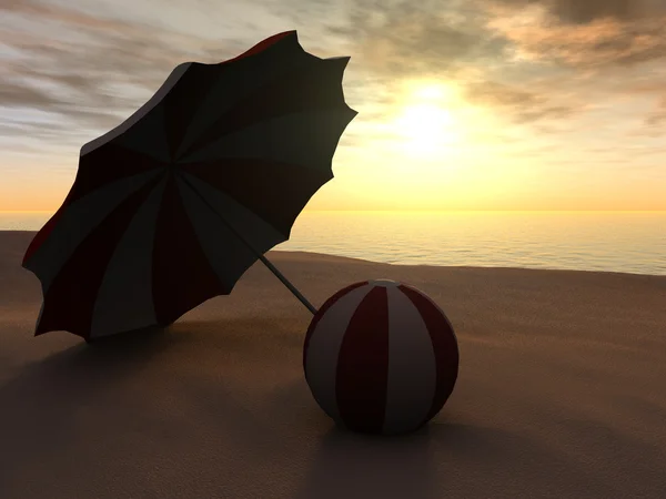 stock image Sun parasol and beach ball on a beach at sunset.