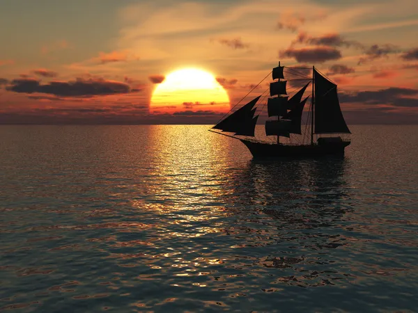 Schip op zee bij zonsondergang. Stockfoto