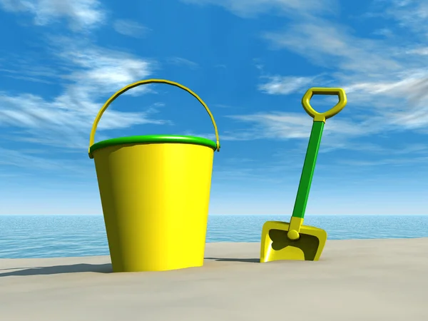 Kbelík a rýč na pláži — Stock fotografie