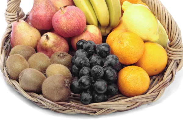Mixed fruit on basket over white — Stock Photo, Image