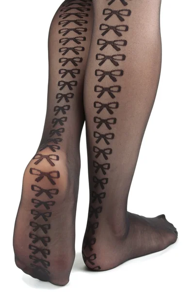 Vrouw voeten met fishnet kousen op witte achtergrond — Stockfoto