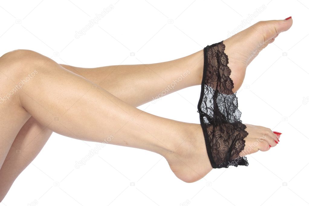 Sexy legs with red taking off underwear over white background