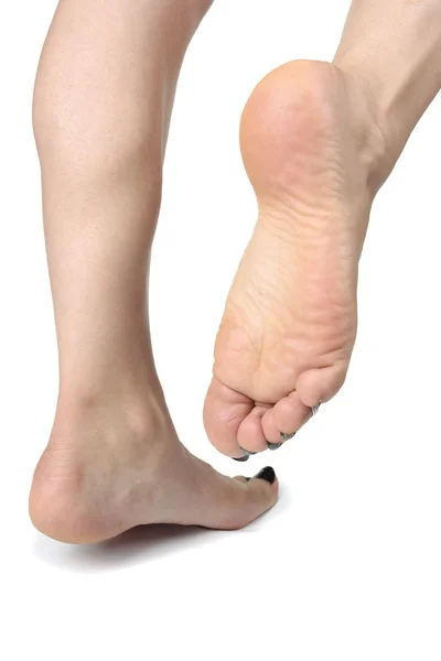 Mulher pés sobre fundo branco — Fotografia de Stock