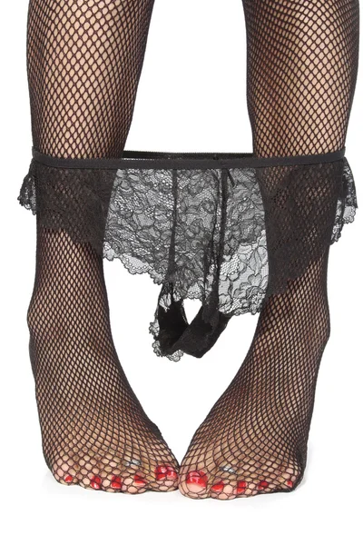 Soyunma üzerinde siyah iç çamaşırı seksi bacaklar arka plan beyaz — Stok fotoğraf