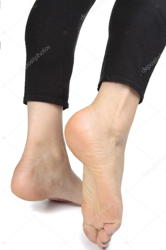 Woman feet with leggings over white background