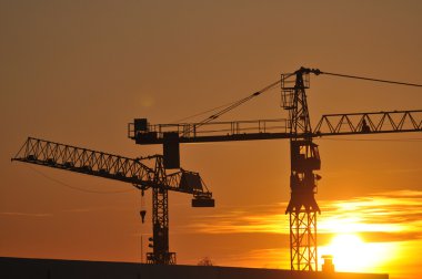 Construction site at dusk clipart