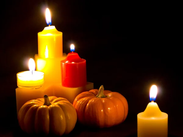 stock image Mini Pumpkins and Candles with a Black Cloth Background