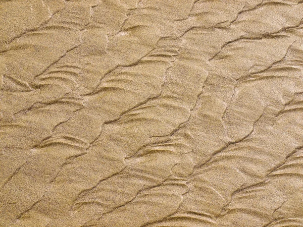 Abstraktní pozadí písku vlnky na pláži — Stock fotografie