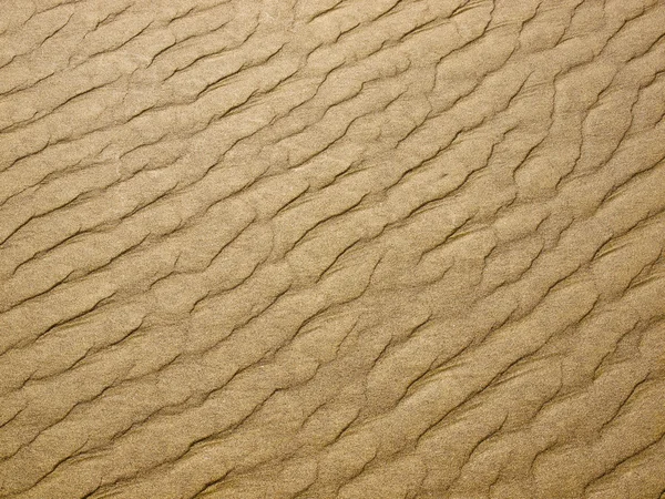 Abstrakt bakgrund av sand krusningar på stranden — Stockfoto