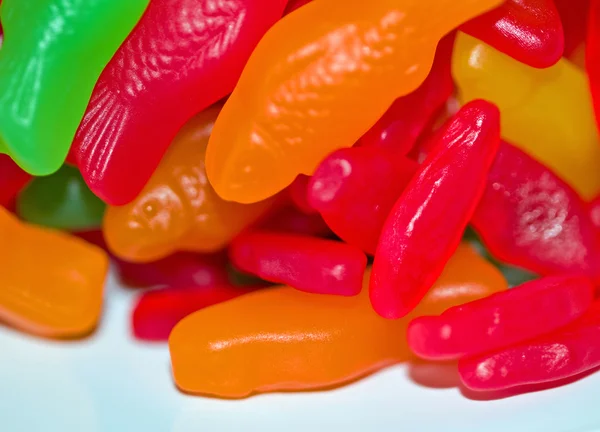 Barevný gumový bonbon rybí zázemí v zelené, červené, oranžové a žluté — Stock fotografie