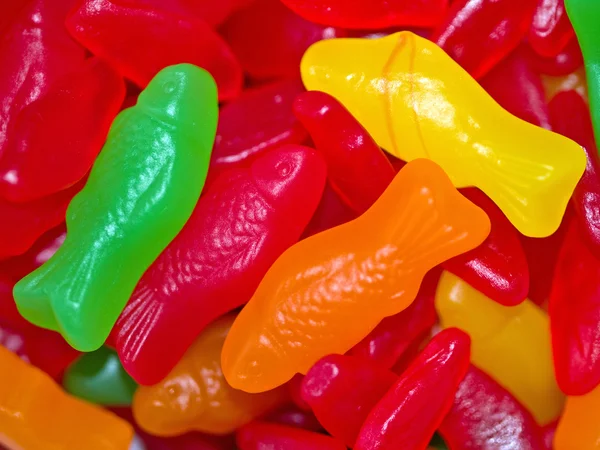 Barevný gumový bonbon rybí zázemí v zelené, červené, oranžové a žluté — Stock fotografie