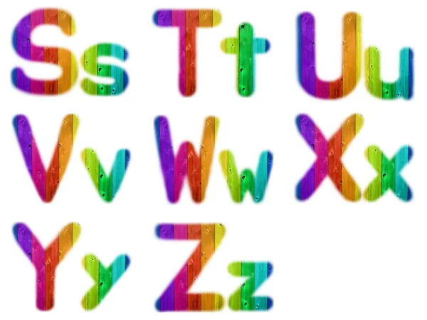 Buchstaben s t u v w x y z mit einem hölzernen Regenbogen-Hintergrund — Stockfoto
