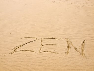 Zen Written in the Sand on a Sunny Day clipart