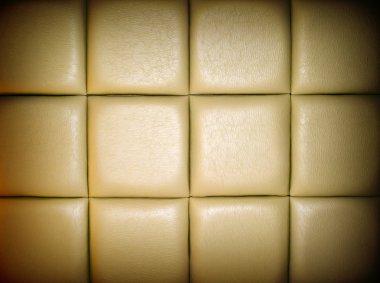 Tan Leather Upholstery Background with a Repetitive pattern and Dark Border clipart