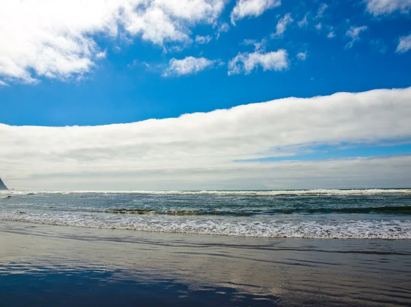 stock image Coastline at the Beach on a Partly Cloudy and Sunny Day
