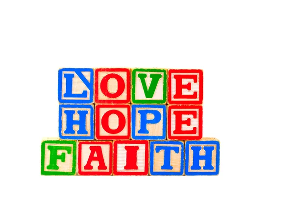 Färgglada alfabetet block tro hoppas och älska — Stockfoto