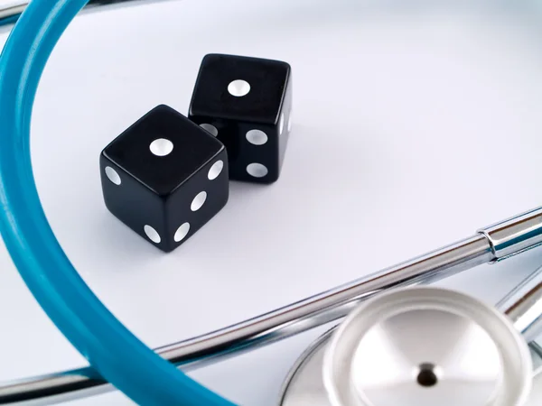 Black Dice and a Stethoscope — Stock Photo, Image