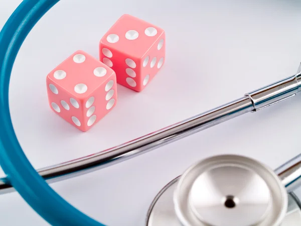 Pink Dice and Stethoscope — Stock Photo, Image