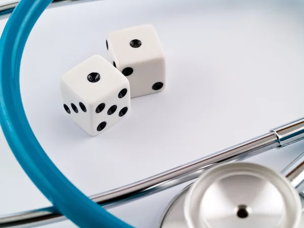 White Dice and a Stethoscope — Stock Photo, Image