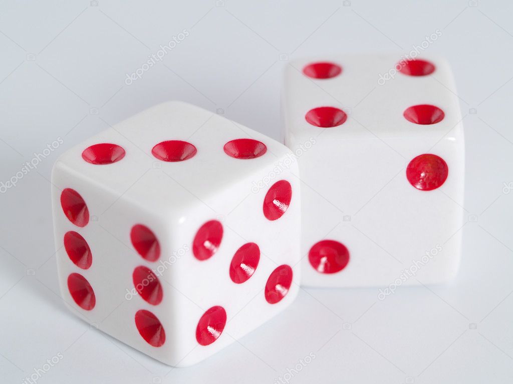 Two white dice closeup on a white background