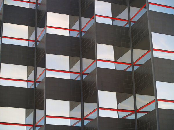 Background of a mirrored and black tiled building