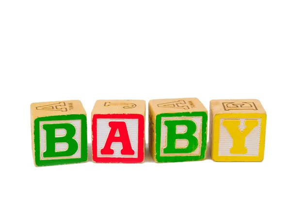 Bunte Buchstabenblöcke buchstabieren das Wort Baby — Stockfoto