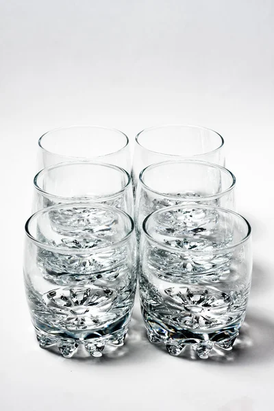 Pustej szklanki na szary — Zdjęcie stockowe