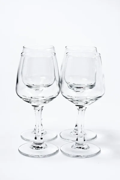 Quatre verres vides isolés sur blanc — Photo