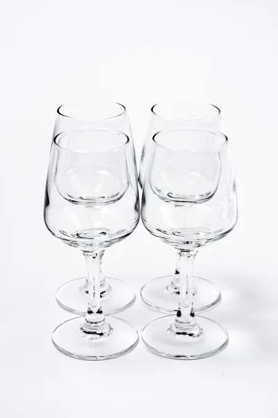 Quatre verres vides isolés sur blanc — Photo