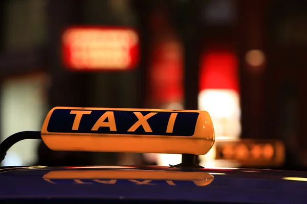Taxi at night, part of car — Stock Photo, Image