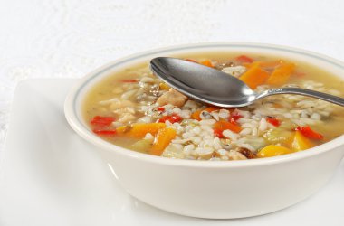 Chicken and wild rice soup with spoon clipart