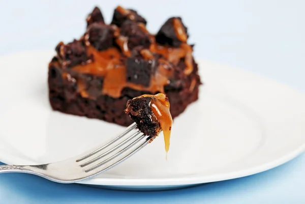 Caramel brownie on a fork — Stock Photo, Image