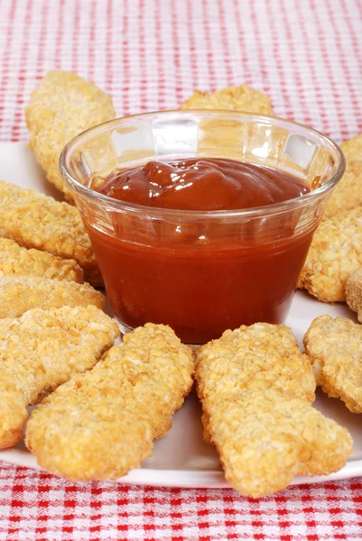 Closeup chicken fingers focus on bowl — Stock Photo, Image
